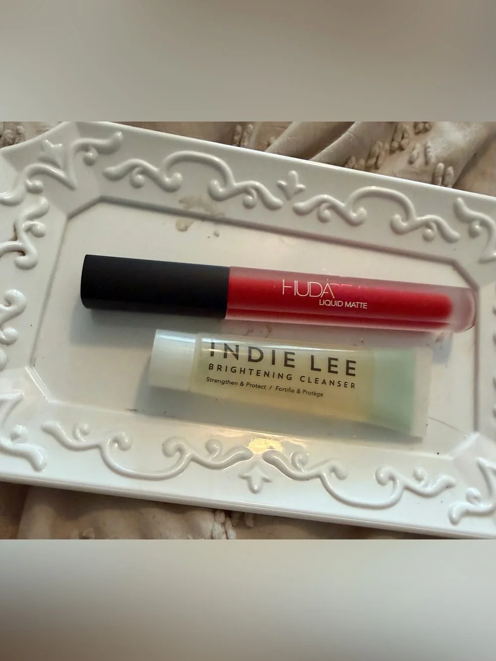 HUDA BEAUTY lip gloss and indie lee cleanser